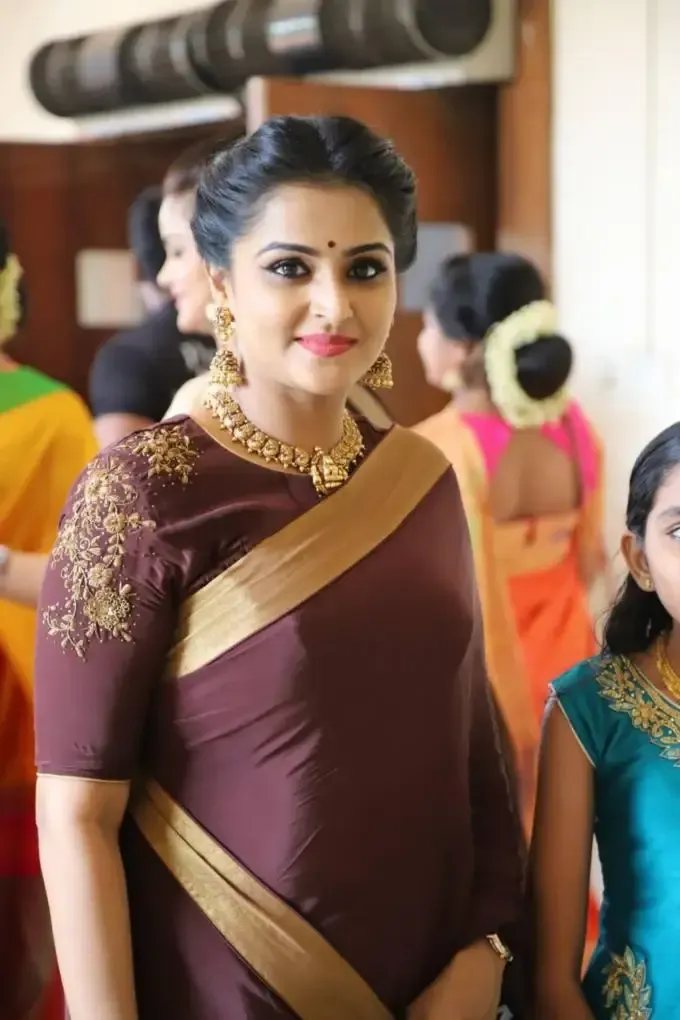 Actress Remya Nambeeshan In Traditional Maroon Saree